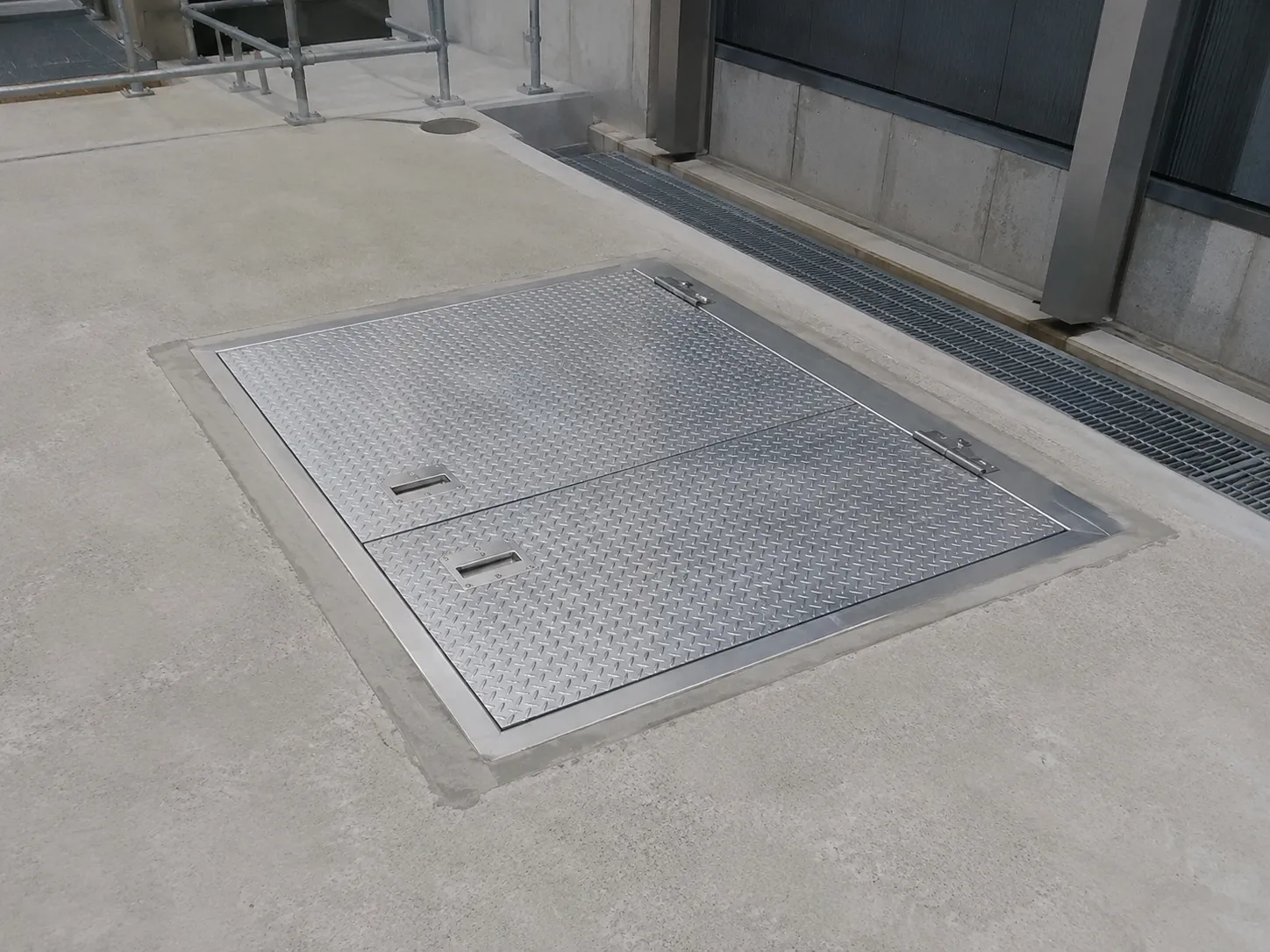 Completed Access Hatch Covers installation in Maple by The Grate Guys