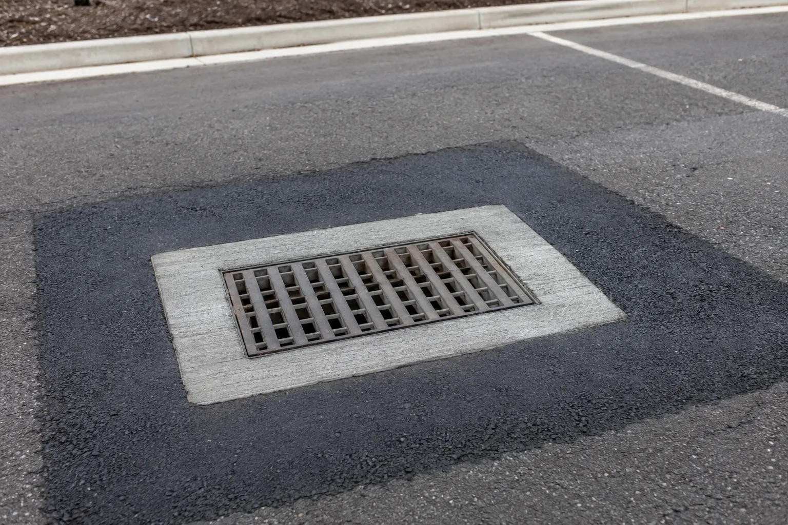 Completed Asphalt Repair Around Drains and Grates installation in Maple by The Grate Guys