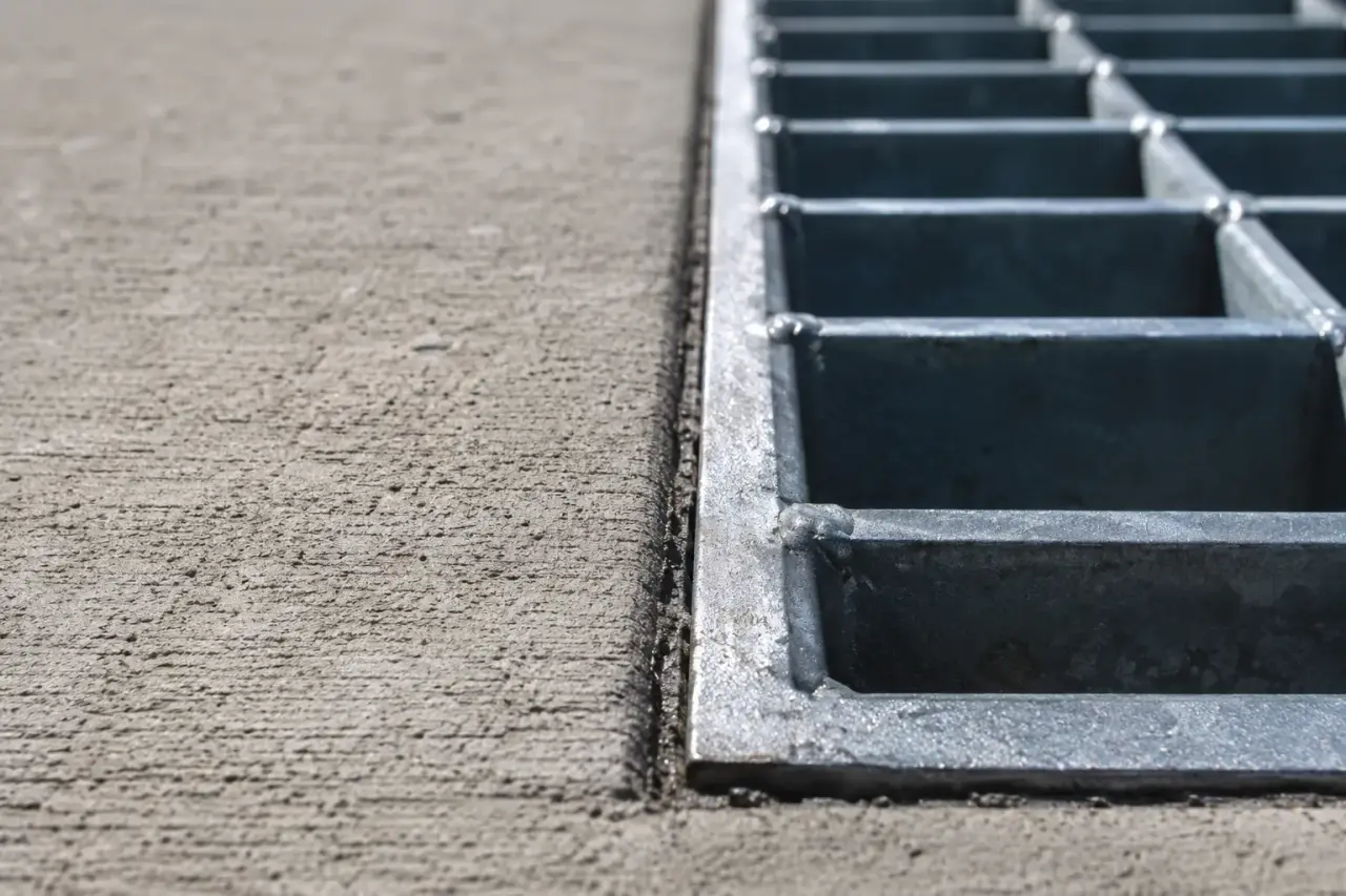 Asphalt Repair Around Drains and Grates being fabricated and installed by The Grate Guys