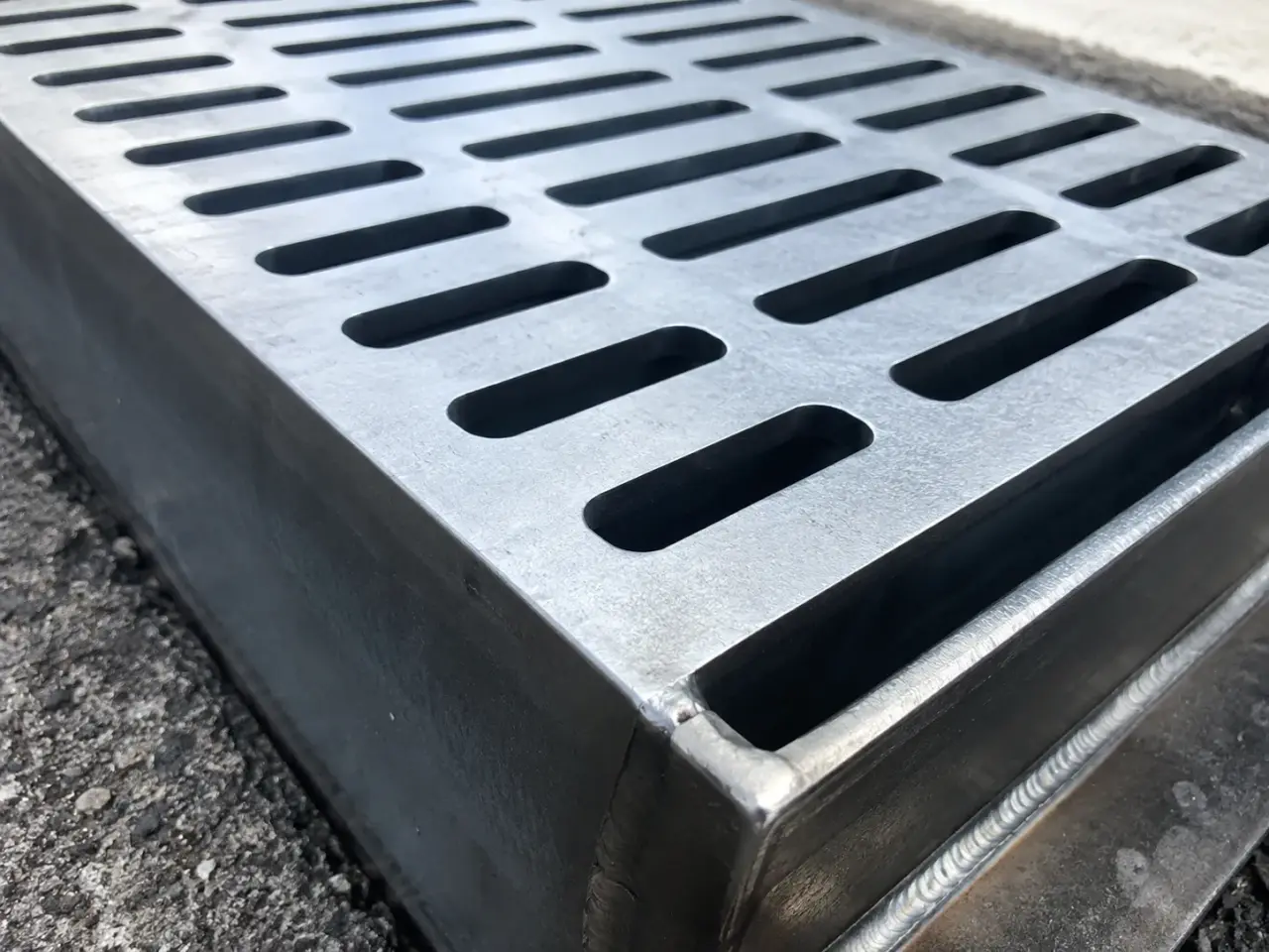 Custom Drain Covers being fabricated and installed by The Grate Guys