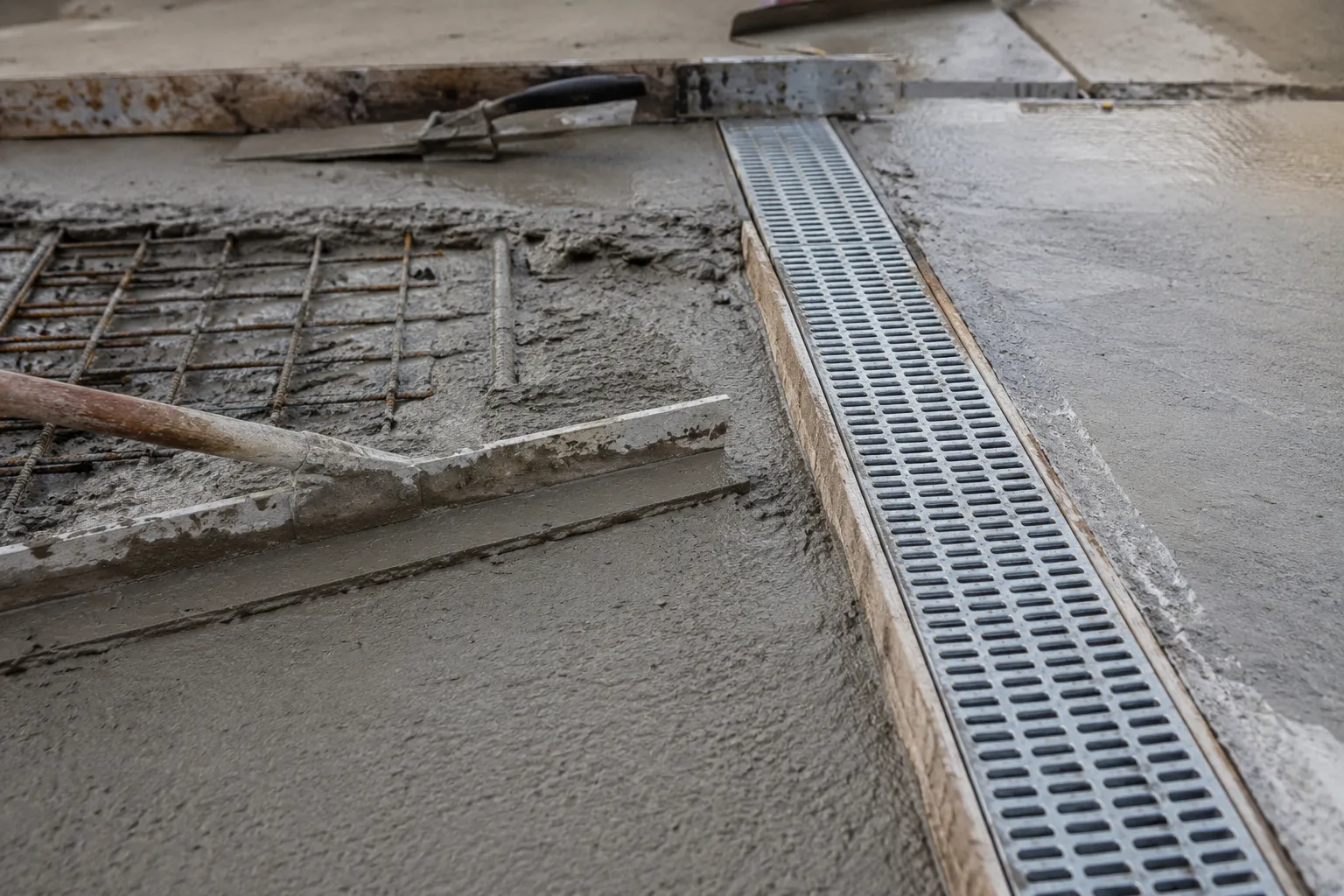 Custom Drainage Solutions in Maple being fabricated and installed by The Grate Guys