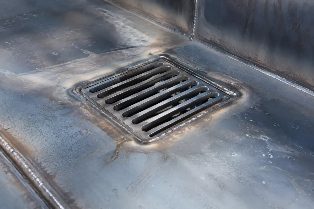 Drainage Repair being fabricated and installed by The Grate Guys