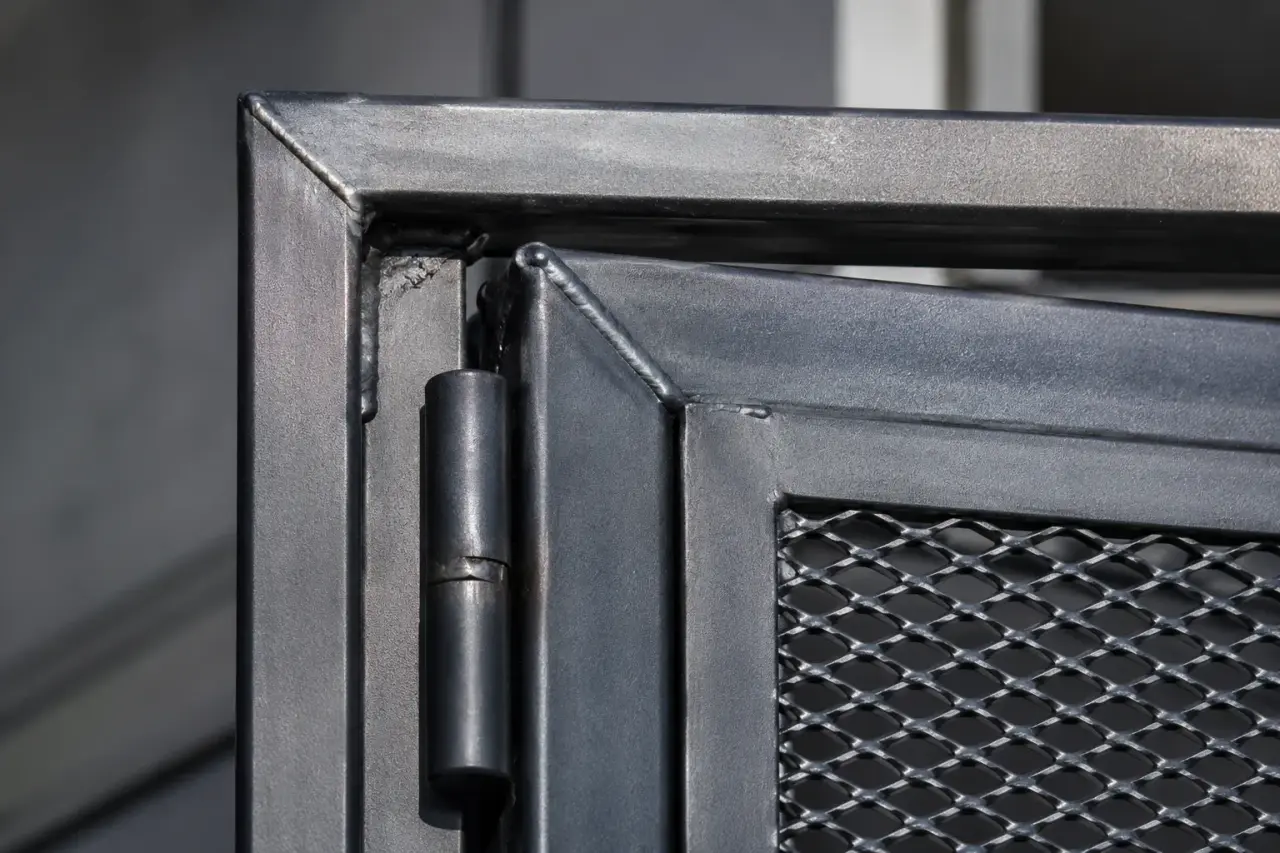 Steel Security Doors being fabricated and installed by The Grate Guys