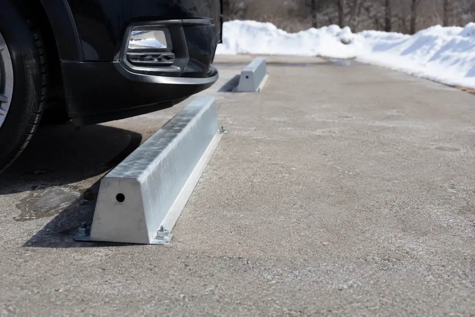 Wheel Stops in Aurora, Ontario, fabricated and installed by The Grate Guys